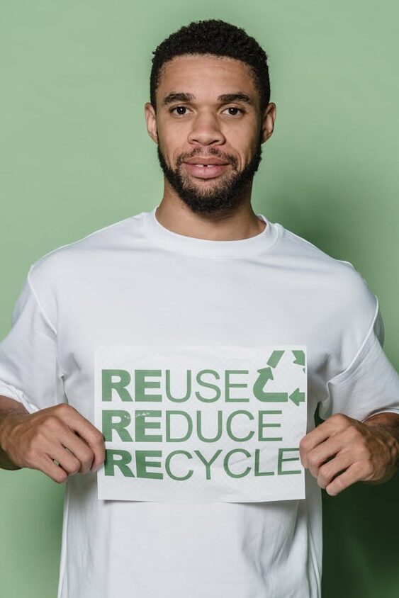man in white and green crew neck t shirt